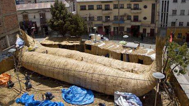 Workers continue construction of the reed boat.