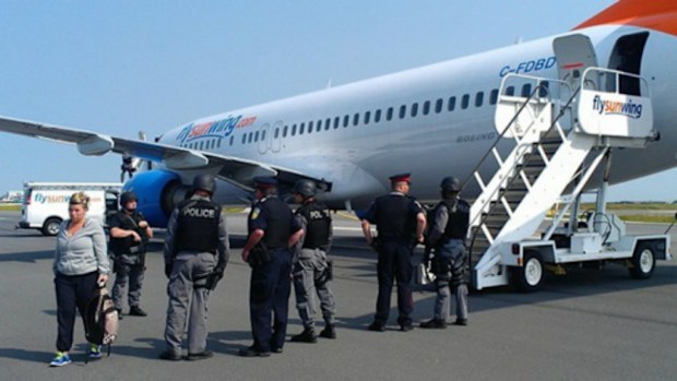A passenger took this photo police outside the diverted plane. (William Alphonso via Facebook)