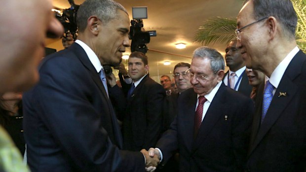 US President  Barack Obama shakes hands with Cuban President Raul Castro. (AFP)