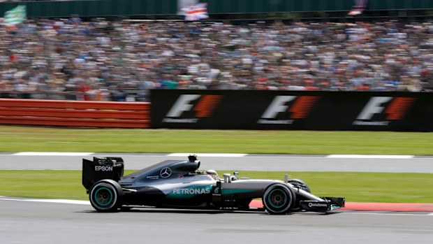 Lewis Hamilton steers his Mercedes on his way to win the British Formula One Grand Prix at the Silverstone racetrack. (AAP)