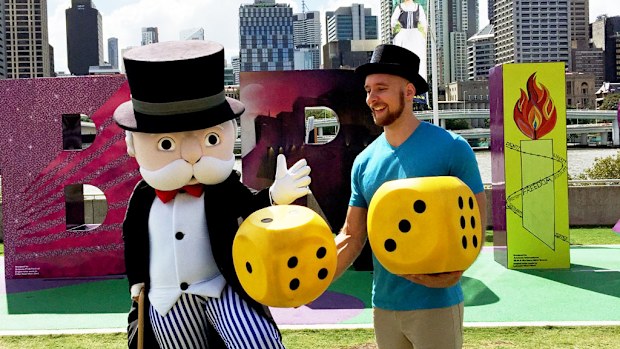 Mr Monopoly with current Australian Monopoly champion and Brisbane resident Tony Shaw at the launch of a new Brisbane version of the game. (AAP/A Little Extra)