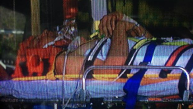 A man aged in his 20s is taken to Royal Perth Hospital after being trapped next to a train. (9News)