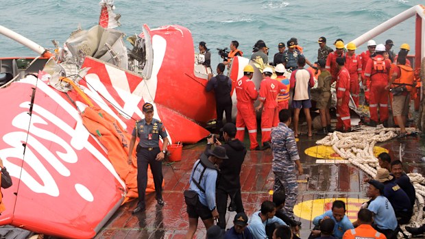 Workers are continuing to salvage bodies and wreckage from the AirAsia crash site.