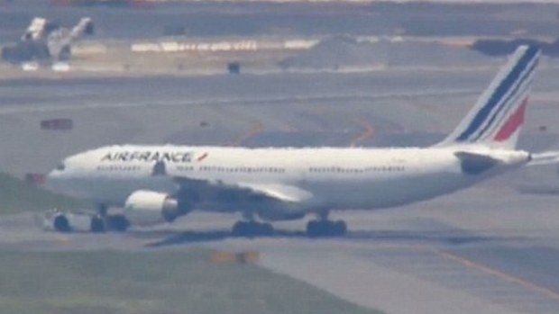 AF002 was escorted back to JFK Airport in New York. (CBS News)