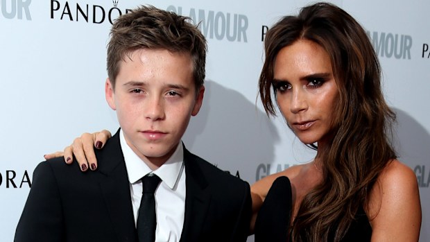 Brooklyn Beckham with his mother Victoria. (AAP)