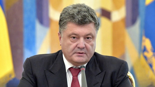 Russian President Vladimir Putin has called Ukrainian President Petro Poroshenko a "partner" and said an aid deal had been reached. (EPA/MYKOLA LAZARENKO / PRESIDENTIAL PRESS SERVICE / POOL)