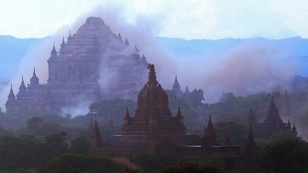 The ancient Sulamuni temple is seen shrouded in dust as a 6.8 magnitude earthquake hit Bagan (AFP)