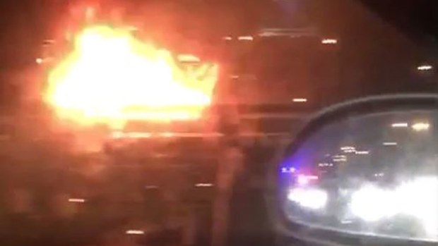 A car in flames on Melbourne's Westgate Freeway. (source: @MarkDoman)