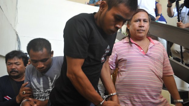 Urbanas Gonghi (grey shirt) and Yohanes Sairokodu in the Crime Detective Office in Bali. (AAP)
