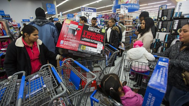 Bargain-hunters scramble at a Walmart in Fairfax, Virginia. (AAP)