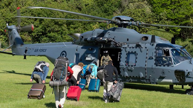 Tourists are being evacuated by helicopte r from Kaikoura following Monday's earthquake. (AAP)