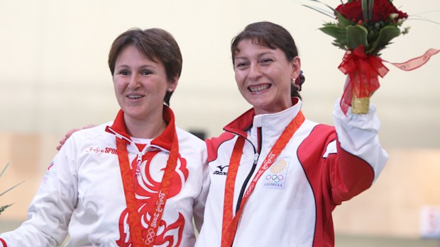 Nino Salukvadze of Georgia (R) after winning the bronze medal for the 10m air pistol women's final at the Beijing Shooting Range Hall, at the Beijing 2008 Olympics. (AFP)