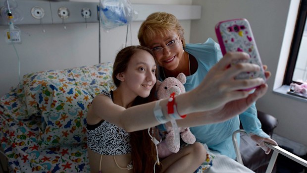 Michelle Bachelet poses for a selfie with Chile's President Valentina Maureira. (AP)