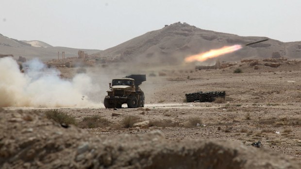  Syrian rocket launcher shell on enemy positions in the ancient oasis city of Palmyra. (AAP)