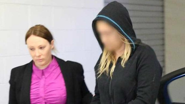 Amanda Crowe, 32, being arrested by detectives over gang-related murder and attempted murder. (AAP)