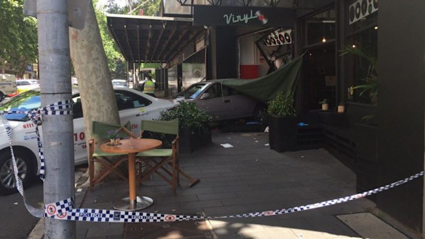 The car smashed into a cafe after hitting the woman and child. (NBN)