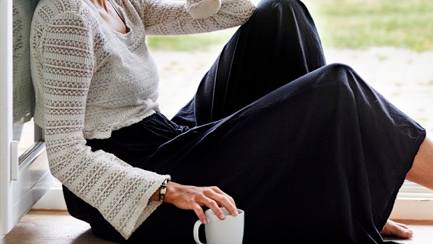 Woman sad sitting on floor