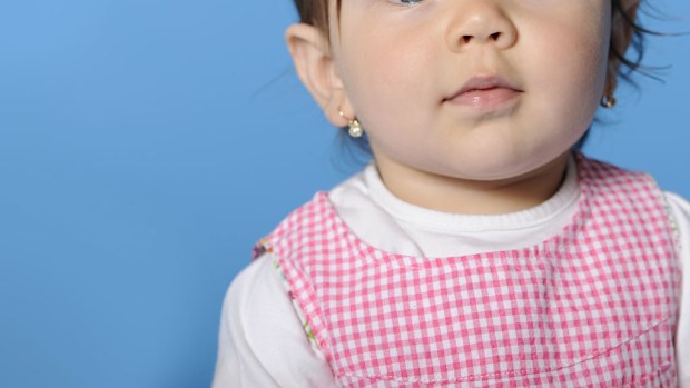 Shop slammed for its policy of physically restraining children to have their ears pierced 