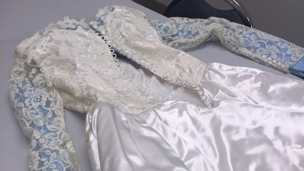 Treasured vintage wedding gown was found by a local newspaper delivery man. (Le Claire police department)