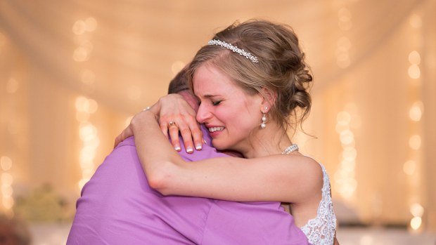Bride saved by bone marrow transplant saved a dance for the donor at her wedding. (Phodot Photography)