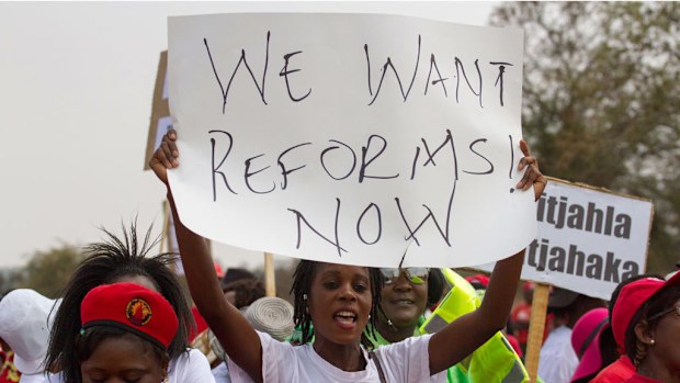 A protester holds a placard as Zimbabwe opposition supporters march through the streets of Zimbabwe's Bulawayo to demand electoral reforms, back on September 17, 2016. (AFP)