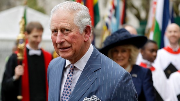 Prince Charles and Camilla the Duchess of Cornwall, in the background, leave after attending the annual Commonwealth Day service at Westminster Abbey in London.