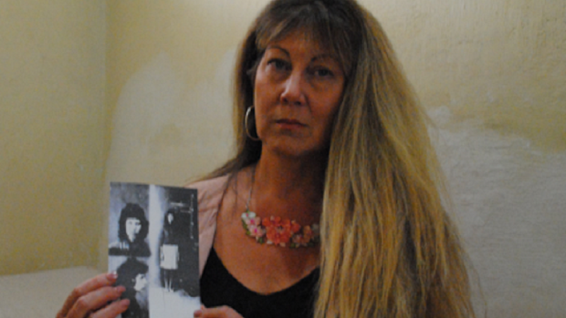 Michelle SBS holding photo of mother