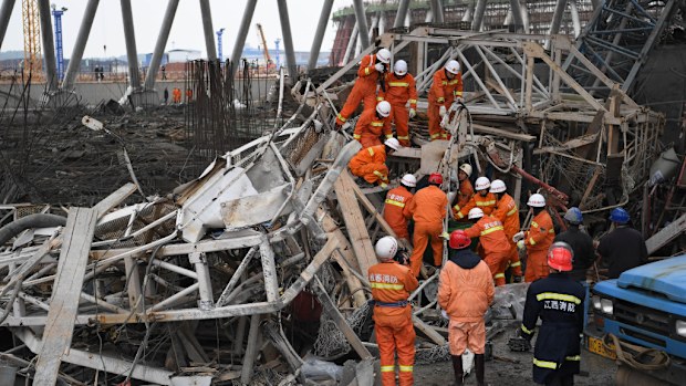 Rescuers are at the scene of a power plant in Jiangxi, China, with reports at least 40 people have died. (AFP)