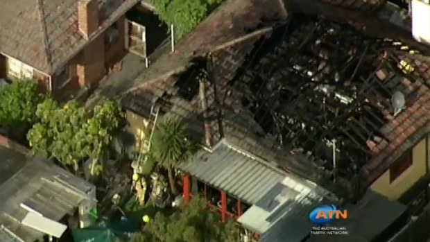 Firefighters assess the damage to the Rosanna house. (Supplied)