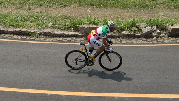 Iranian cyclist Bahman Golbarnezhad has died after falling while competing in Rio. (AAP)