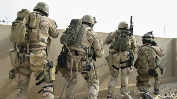 US Navy SEALs fire on insurgents in Ramadi, Iraq, in 2006. (AAP)