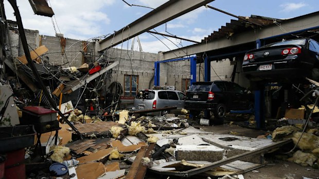 A tornado ripped the roof off of N.C.'s Auto Repairs as it passed through in Revere. (Photo by Jessica Rinaldi/The Boston Globe via Getty Images)