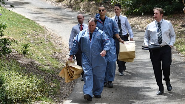 Police leave the Eltham man's home. (AAP)
