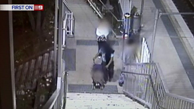 The young couple brought their child along for the robbery of Yennora station, in Sydney's west. 