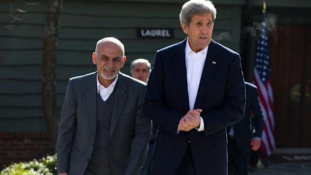 Afghan President Ashraf Ghani with US Secretary of State John Kerry. (AAP)
