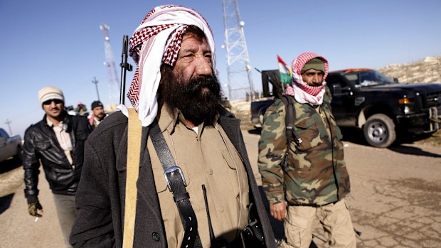 Yazidi fighters prepare to battle ISIL militants on Mount Sinjar. (AAP)