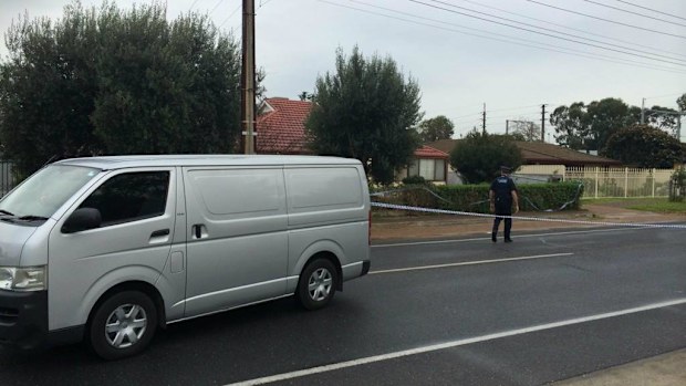 The coroner leaves a Parafield Gardens home were a man was murdered. (9NEWS)