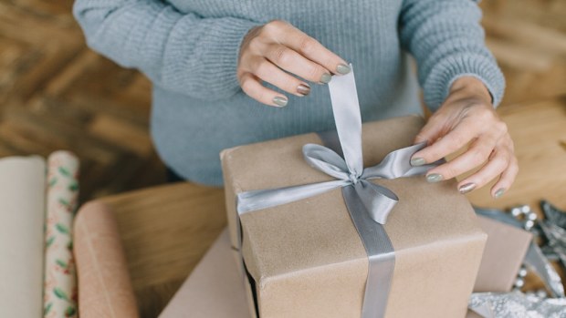 Wrapping a Christmas present.