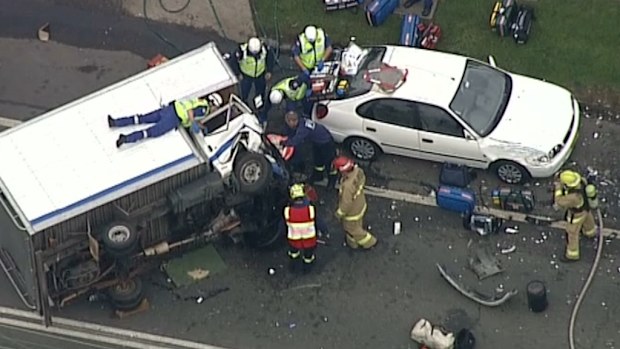 Three people have been trapped in a truck cabin after a Sydney crash. (9NEWS)