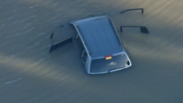 The Toyota Kluger sits in a lake near Wyndham Vale.