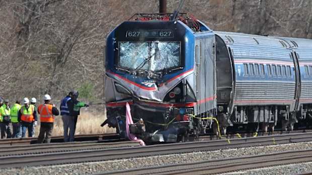 The Amtrak train crashed into an excavator, killing two. (AAP)