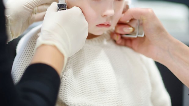 Shop slammed for its policy of physically restraining children to have their ears pierced 