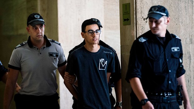 Mourad Hamyd, 20, escorted by police officers arriving at court in Sofia on August 10, 2016. He was arrested last month in Turkey while allegedly trying to enter Syria. (AFP)