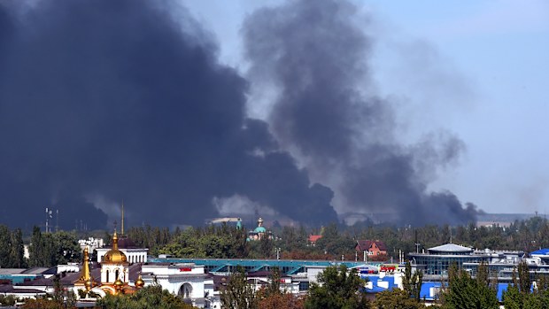 Black smoke ascends around Donetsk International Airport as shelling continues between pro-Russian forces and the Ukrainian army.