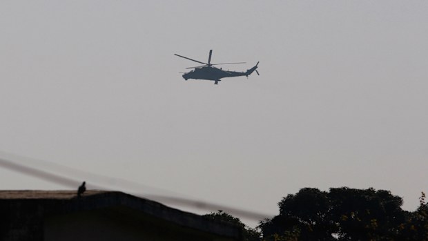 An Indian air force gunship on a reconnaissance mission flies over the Indian airbase in Pathankot. (AP)