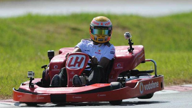 British Formula One race car driver Lewis Hamilton drives a go-kart around the Eastern Creek go-kart track in Sydney. (AAP)