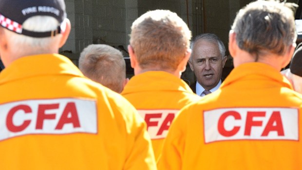 Prime Minister Malcolm Turnbull with CFA volunteers: New legislation to protect emergency volunteers has been criticised by a number of Victorian politicians. (AAP)