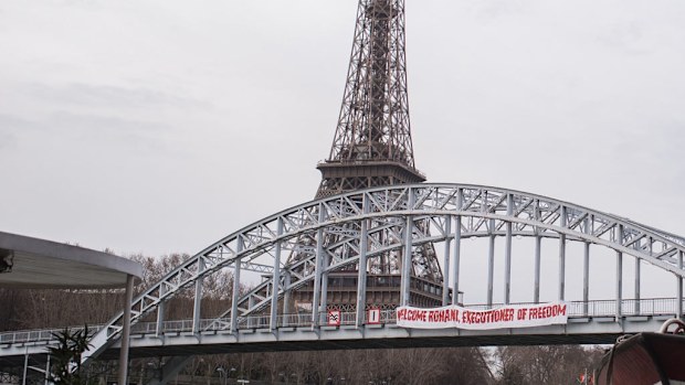 A banner that read 'welcome Rouhani, executioner of freedom' was placed on the bridge. (AAP)