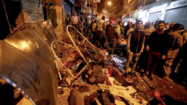 Damage at the site in the aftermath of a twin suicide attack in the Burj al-Barajneh suburb of Beirut, Lebanon. (AAP)