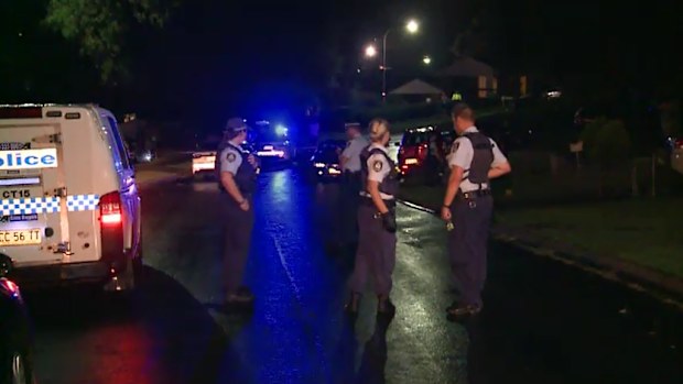 Police at the scene in Claymore. (9NEWS)